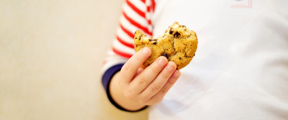 Boy holding cookie