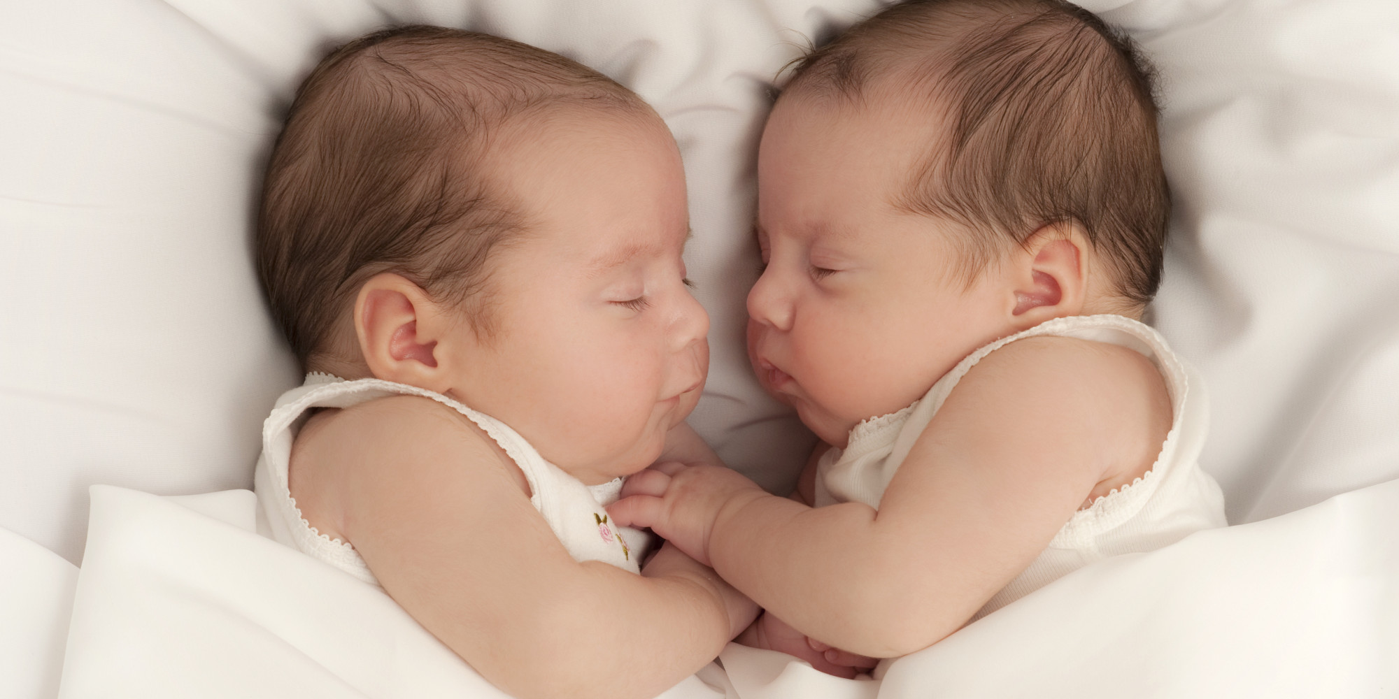 Newborn twins sleeping